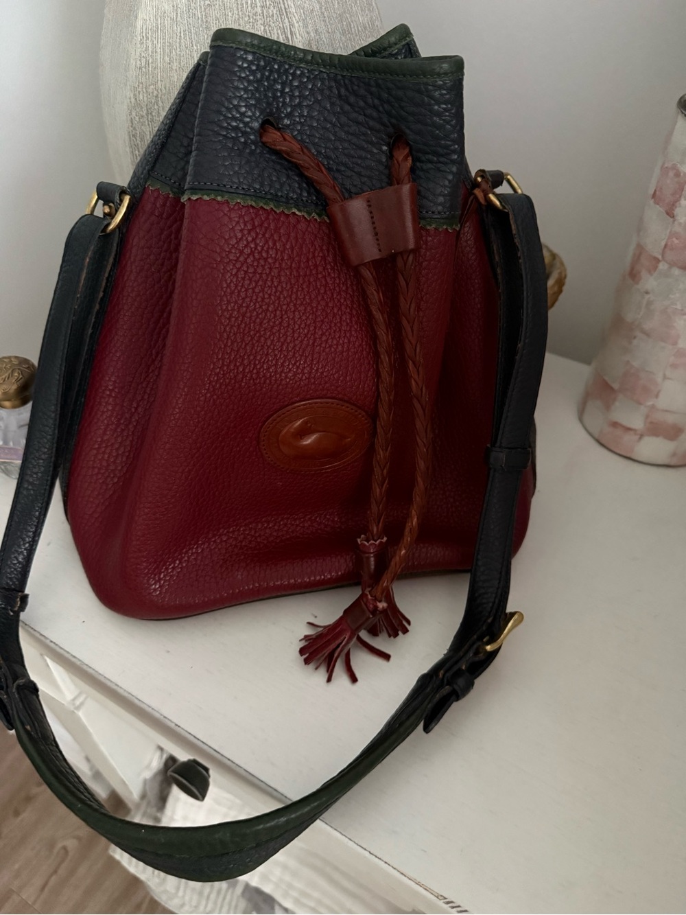 Dooney & Bourke Burgundy Bucket Bag with Green Trim and Brown Accents